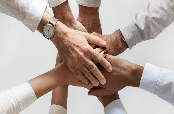 people-putting-hands-over-hands